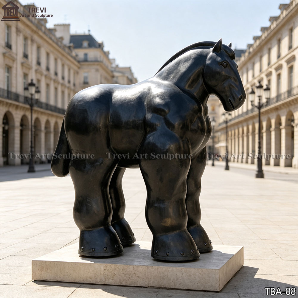 Small bronze horse bust on a shelf, styled as part of a curated library display