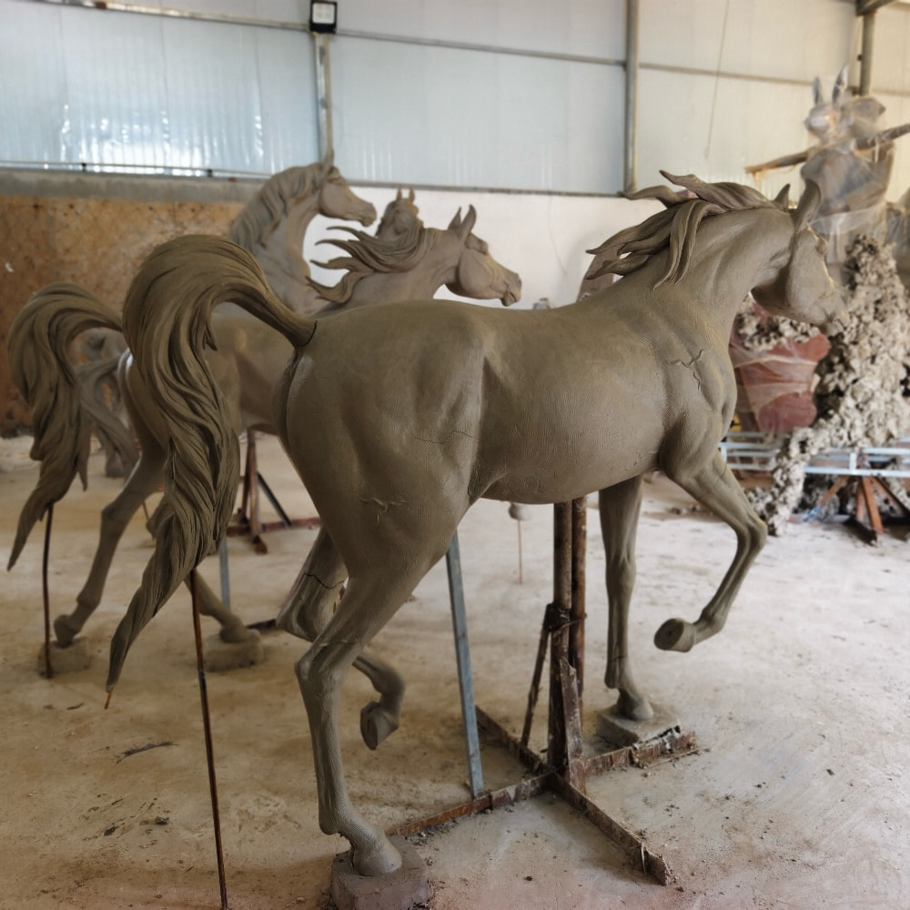 Trevi artisans modeling a custom bronze horse